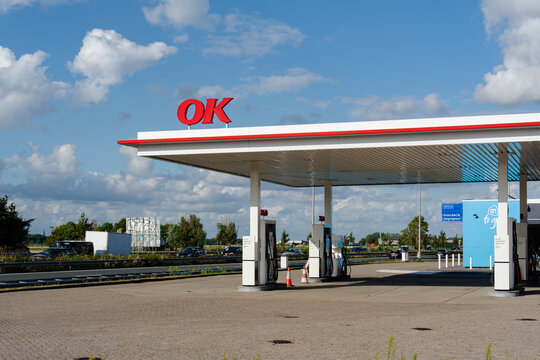 August 21, 2026, Amsterdam, Netherlands - OK gas station with fuel pumps and an AH to go sign