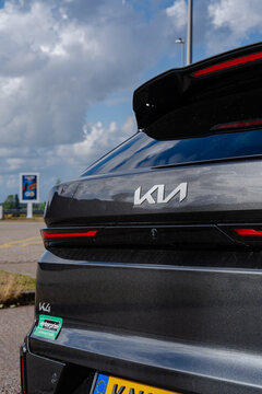 August 21, 2026, Amsterdam, Netherlands - Rear view of a dark grey Kia K4 car with Enterprise sticker