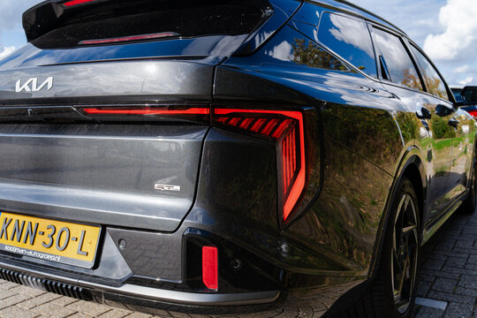 August 21, 2026, Amsterdam, Netherlands - Rear view of a dark grey Kia EV6 GT-Line electric crossover parked outdoors
