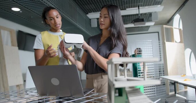 Two Women Architects Collaborating in Modern Office Space