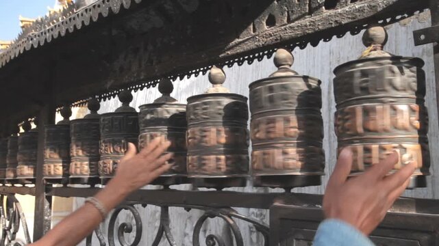 Tibetan prayer wheels spinning 