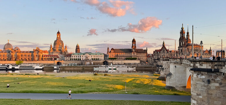 Landscape of historical buildings along the river at sunset in Dresden, Germany 