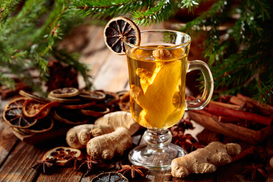 Ginger tea with spices and fir branches.