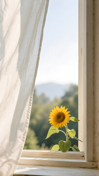 Yellow sunflower sitting by a bright window frame with soft curtains looking out to a sunny mountain landscape smartphone wallpaper background