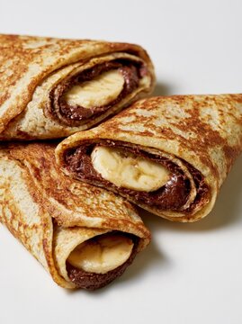 Banana and Chocolate Filled Crepes in a Three Roll Stack