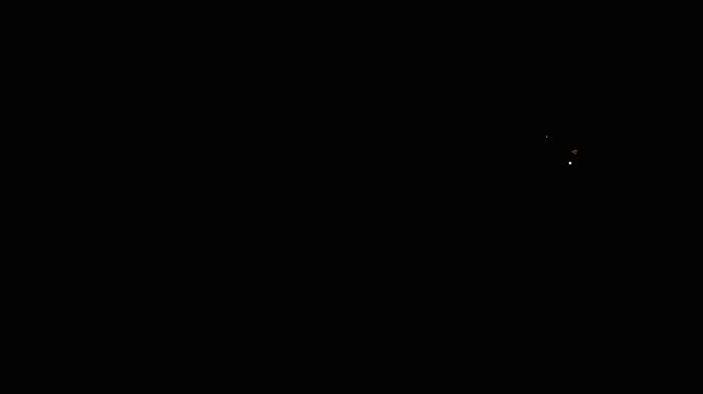 Golden comet trail with sparkling glitter particles, shining starbursts and magical fairy dust, glowing light tail moving in a smooth curve across black screen, cinematic 4k animation