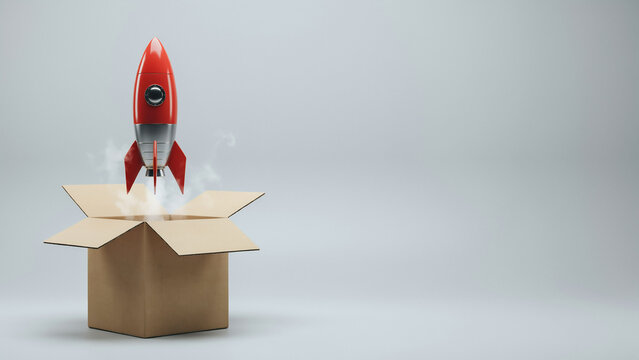 red rocket launching out of cardboard box think outside the box concept