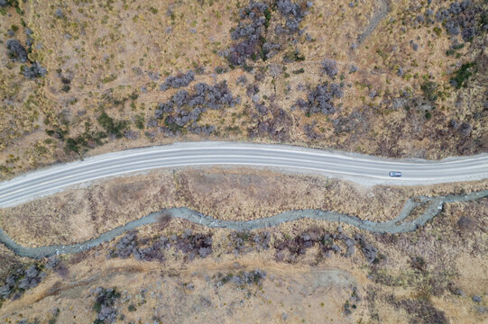 Aerial top view of a car driving  through  Liindis pass