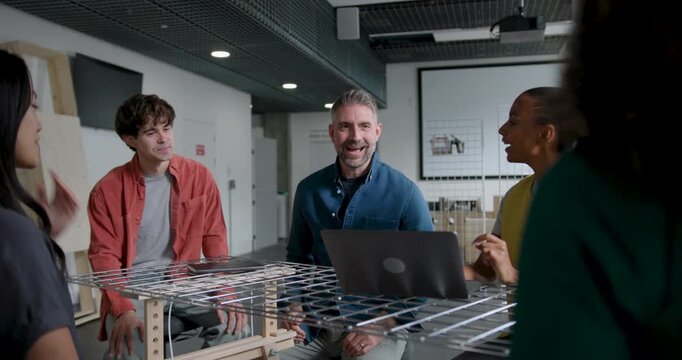 Business People Working and Collaborating in Around a Table in Modern Office
