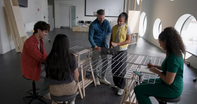 Business People Working and Collaborating in Around a Table in Modern Office