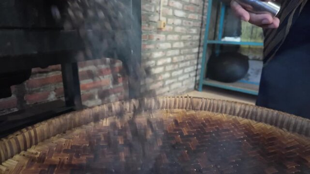 Pouring Roasted Coffee Beans.
