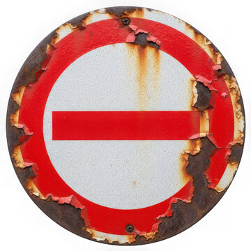 Old weathered circular no entry traffic sign with heavy rust isolated on a black background