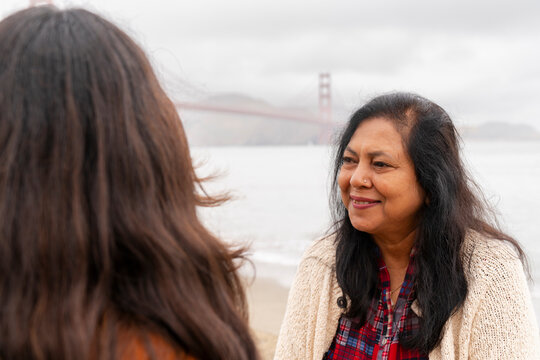 happy woman having candid conversation grin