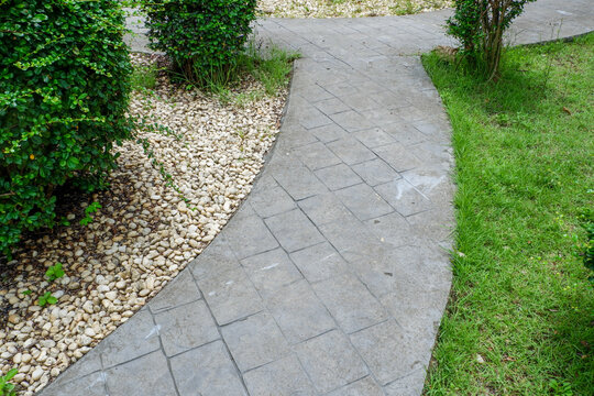 Garden landscape design with pathway in garden and footpath in picturesque summer park and staircase in backyard,Paving stones on floor in park,space for text.