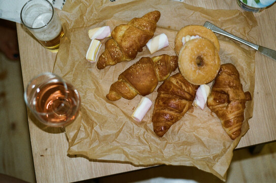 Fresh Baked Goods on a Table With Drinks