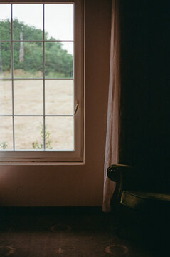 Window View With Chair in a Room During a Cloudy Day