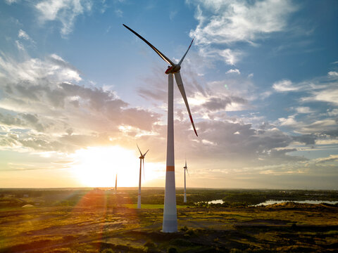 Wind Turbines at Sunset in an Open Landscape