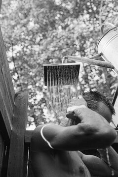 Man having a shower outdoor.