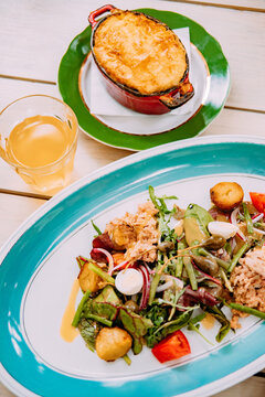Lunch served on a table with a salad and a baked dish