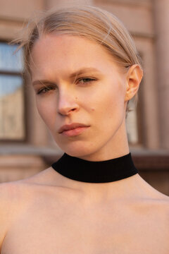 Close-up portrait of a young blonde woman.