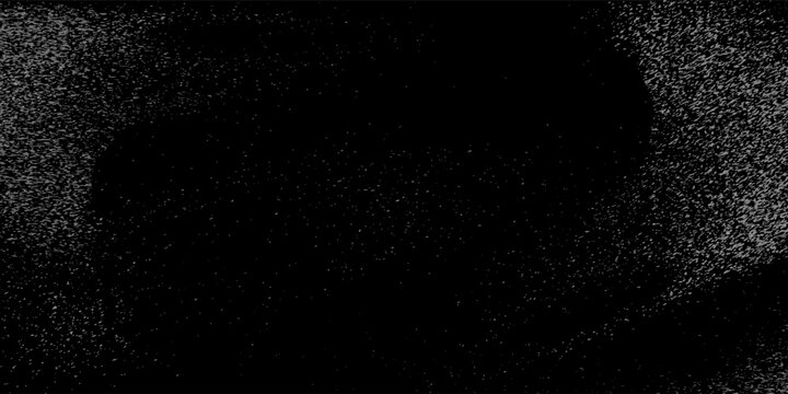 Flying dust particles on a black background