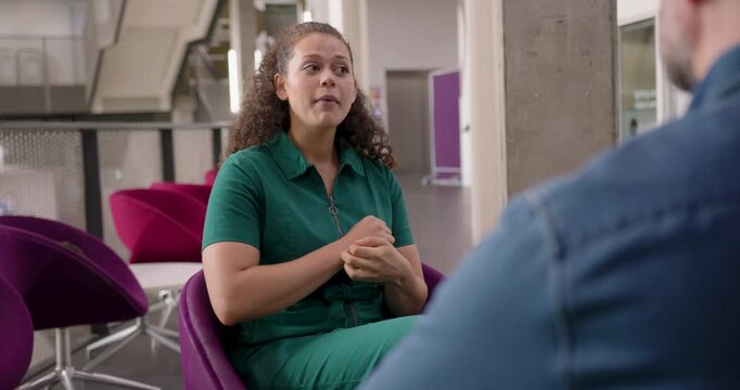 Engaging Business Meeting with a Young Woman in Open Plan Modern Office