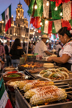 Mexican street food market with tacos and elotes during Independence Day festival
