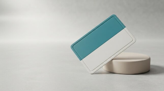 Modern blue and white plastic credit card mockup on a round pedestal