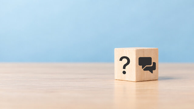 Q and A concept. Q and A symbols on wooden cube block on a grey background. Illustration for frequently asked questions concepts in websites, social networks, business issues. Recommendation concept.
