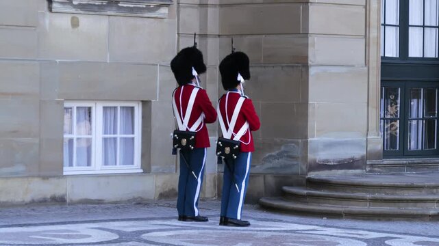 Royal guards standing at Amalienborg Palace in Copenhagen city, Denmark
