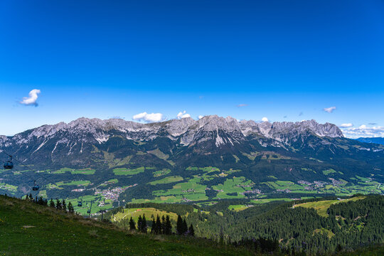 Beautiful panorama view of Wilder Kaiser massif with Ellmauer Halt peak from mountain Brandstadl in summer on sunny day, Scheffau, Tyrol, Austria