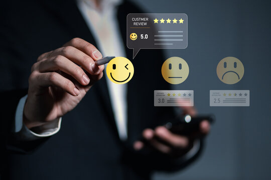 Customer satisfaction concept with a business professional selecting a five star rating on a digital feedback interface, customer review, service, experience, reputation, quality