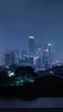 Vertical video - Timelapse of Jakarta central business district on a rainy night