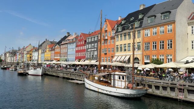 Waterfront view of colorful buildings in Nyhavn harbor, Copenhagen, Denmark