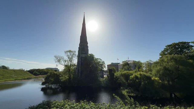 Backlit wide shot of St. Alban's Church in Copenhagen city, Denmark