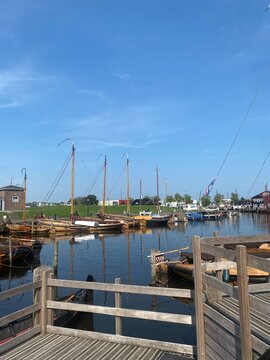 Traditional boats moored in the harbor of Elburg, Netherlands