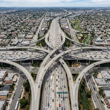Aerial View Of Complex Urban Highway Interchange With Busy Traffic Flow