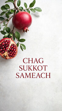 Pomegranate branch with hebrew holiday greeting on textured pale background, sukkot harvest celebration, jewish autumn festival card, fresh fruit foliage, seasonal tradition