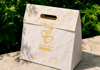 Outdoor Stone Ledge with Paper Pastry Bag Mockup