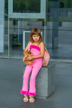 Little girl going on holiday with suitcases at airport
