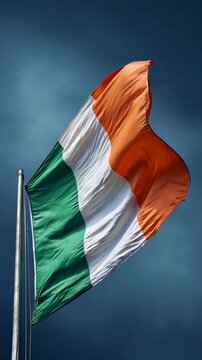ireland irish flag waving in blue sky