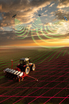 Modern tractor planting corn with precision seeder on agricultural field