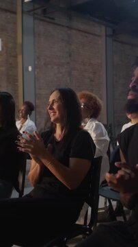 Diverse group of people clapping hands during meeting gathering expressing positive affirmation engagement support and authentic community connection indoors