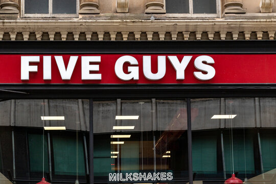 Five Guys Restaurant Sign in Glasgow, Scotland, UK.