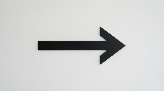 Black arrow pointing right on a wall
