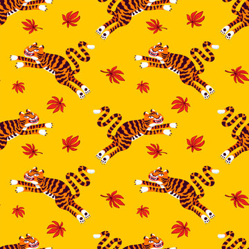 Asian seamless pattern with jumping tigers on yellow background. Drag to swatches panel to use