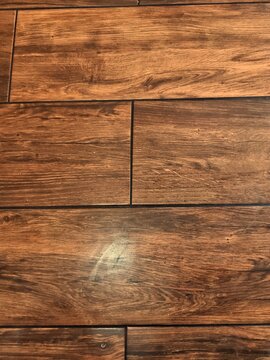 Polished rich dark wood flooring pattern background for premium interior web backdrop
