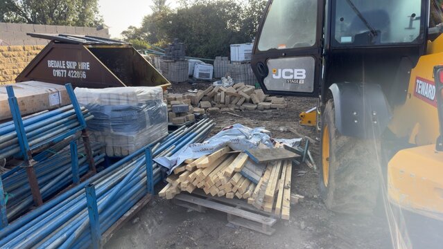 Construction Site with JCB and Materials at Brierley Homes, Kirkby Malzeard, UK.