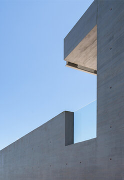 Modern concrete hotel building under construction against sky