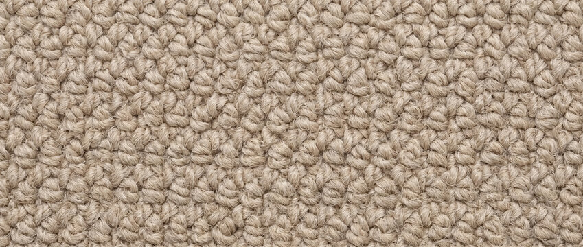 Neutral beige carpet fiber loop pile texture. Soft floor covering material background